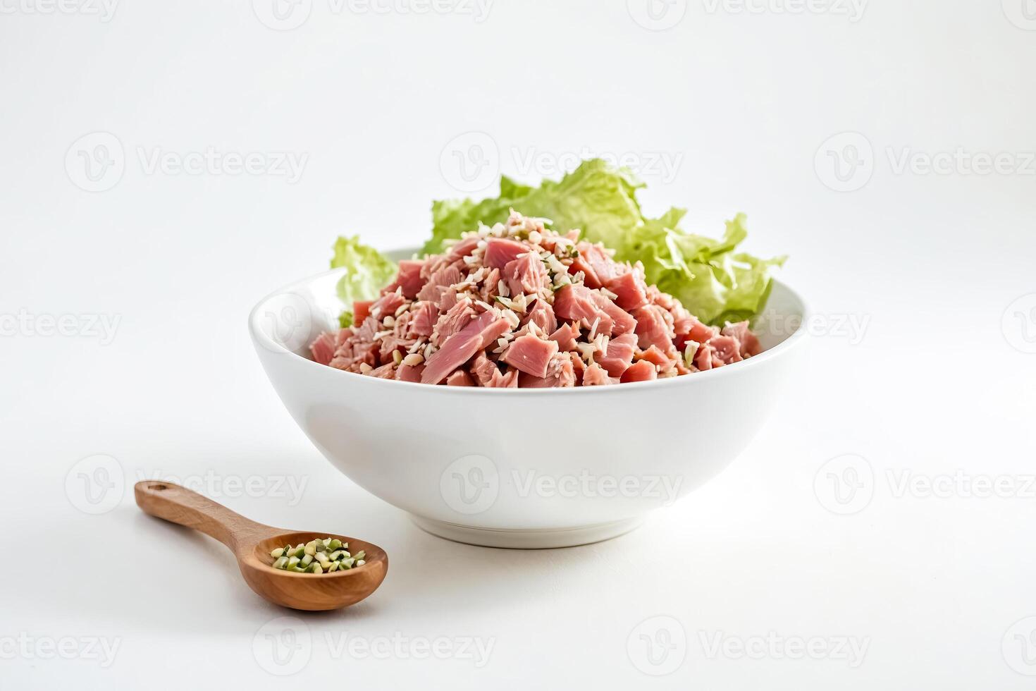 Close-up of a bowl of tuna salad with lettuce and sesame seeds photo