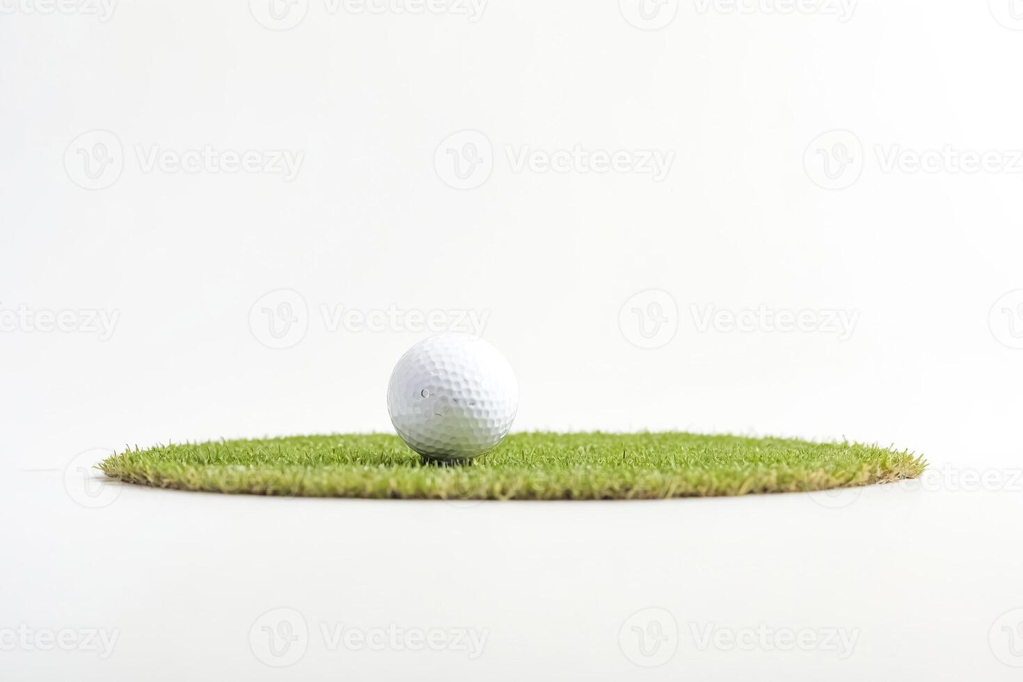 Golf ball on a patch of artificial grass photo