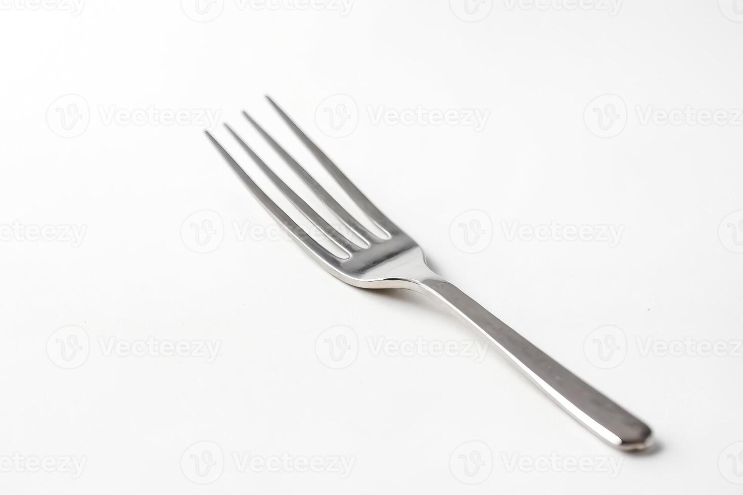 Silver fork on white background photo