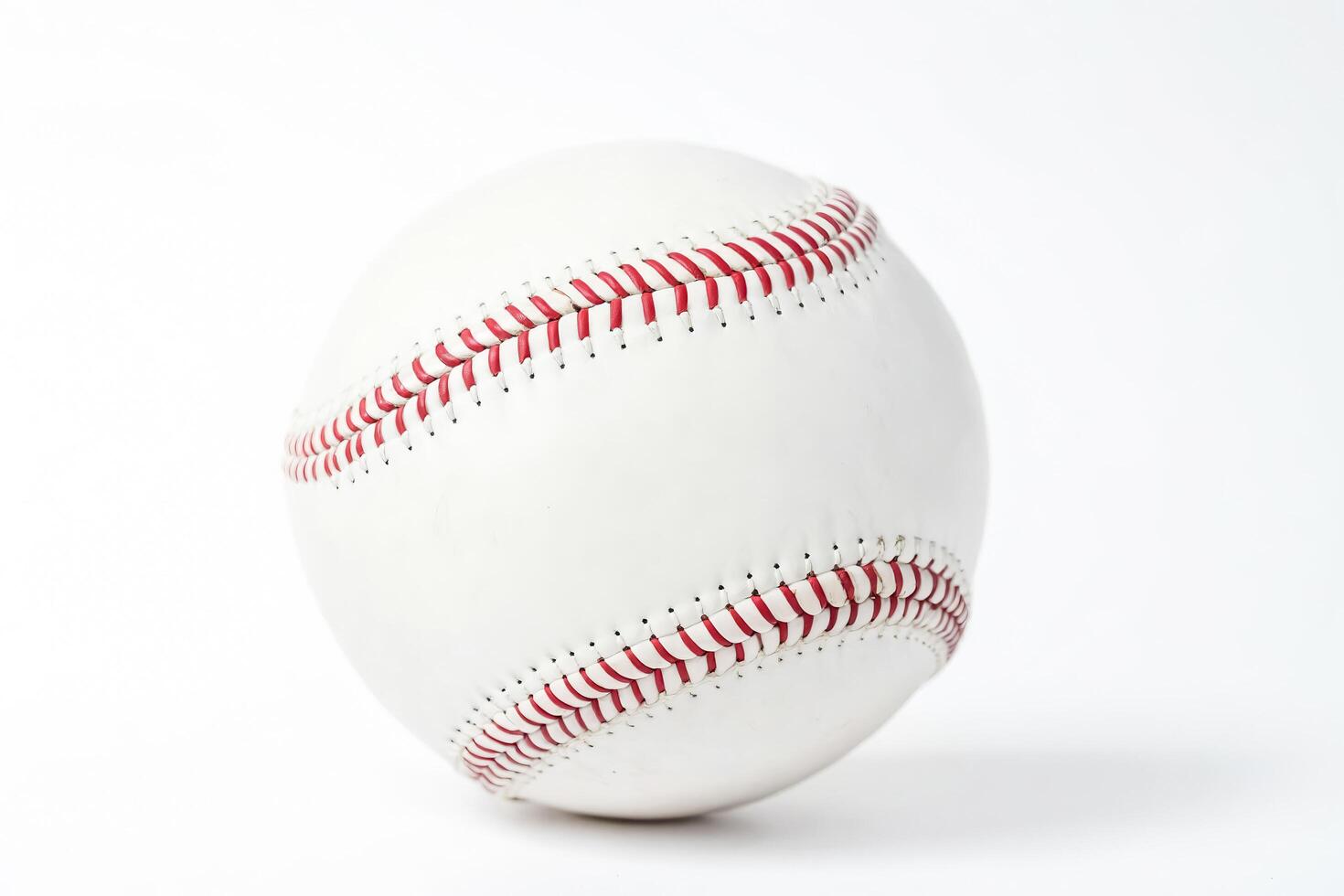 Baseball with Red Stitching on White Background photo