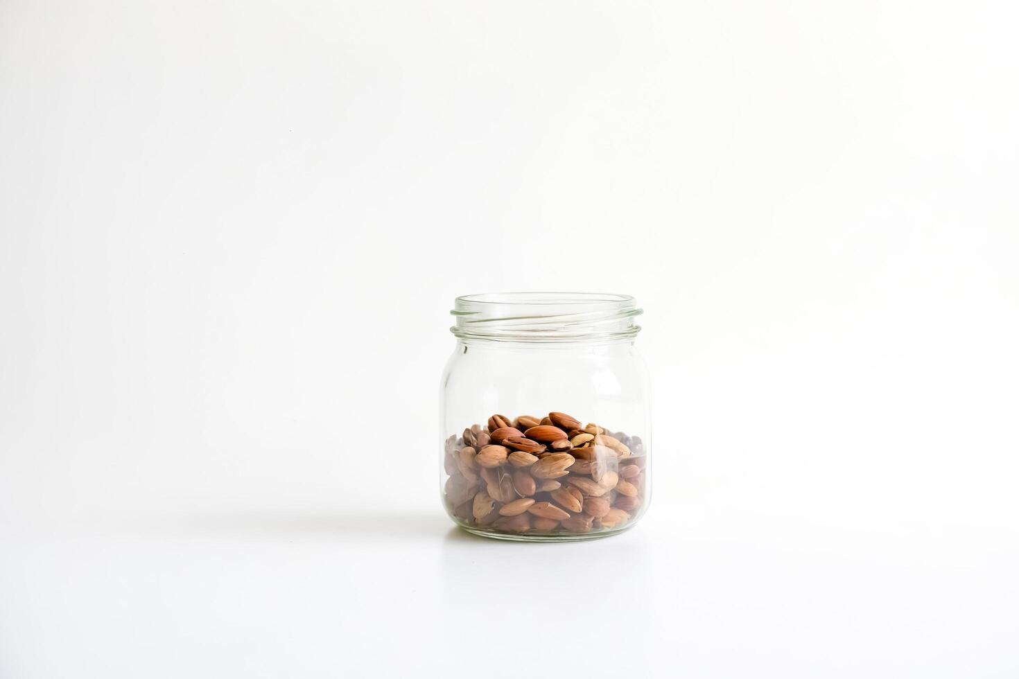 Jar of Nuts on White Background photo