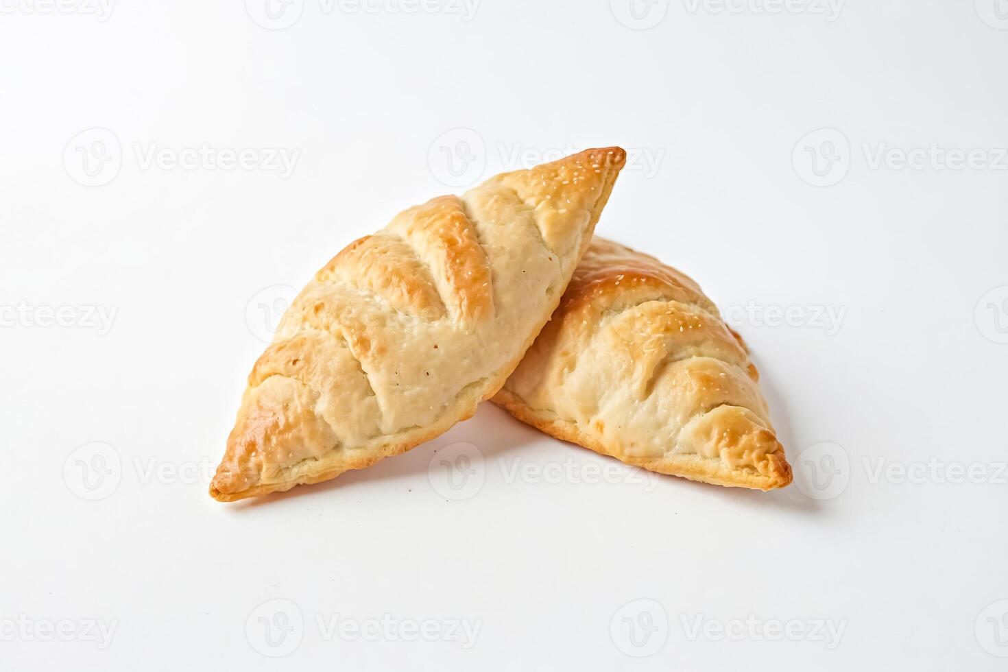 Two Delicious Pastry Pockets on White Background photo