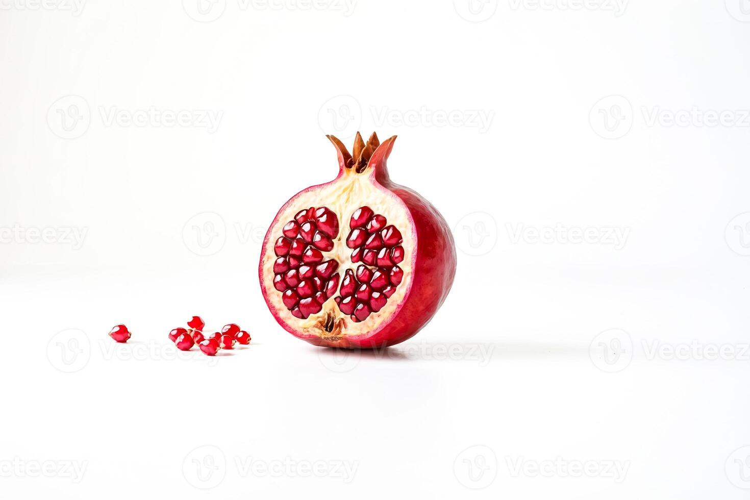 Pomegranate Half with Seeds on White Background photo