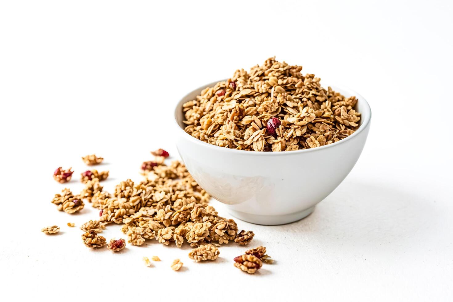 Granola with Nuts and Dried Cranberries in White Bowl photo