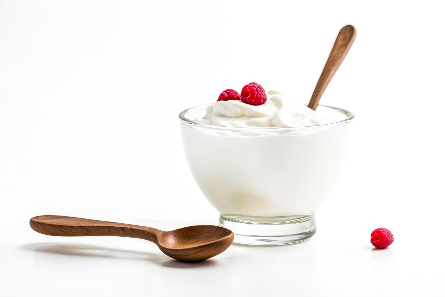 Delicious yogurt with raspberries and wooden spoons photo