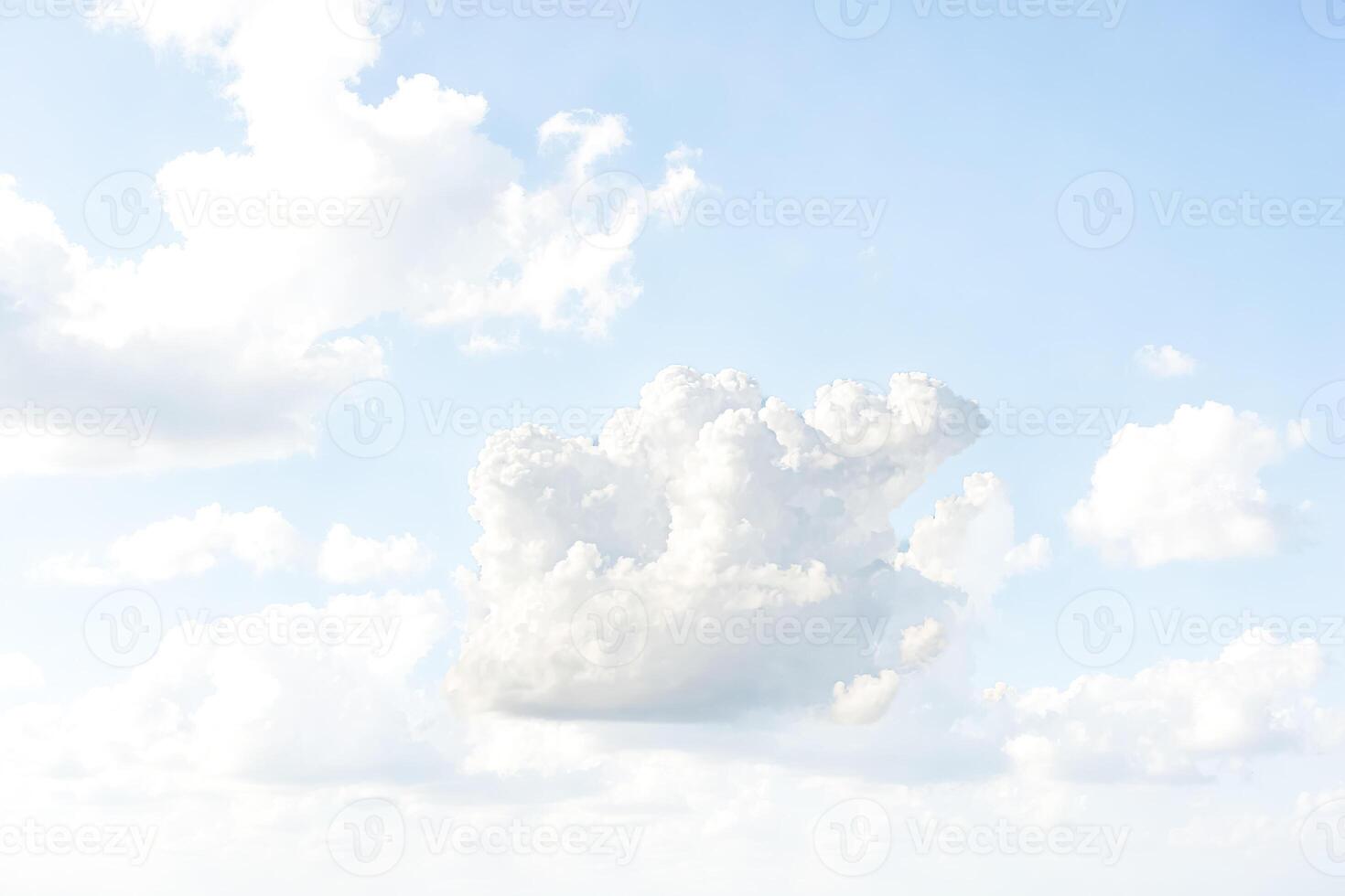 Fluffy White Clouds in a Light Blue Sky photo