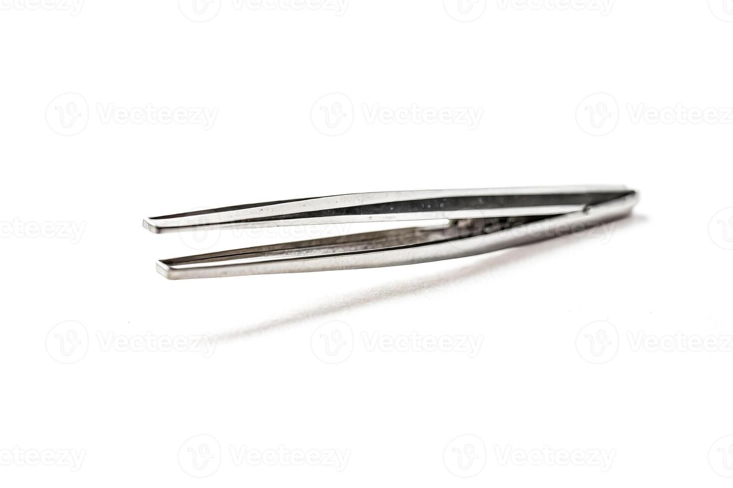Stainless Steel Tweezers on White Background photo