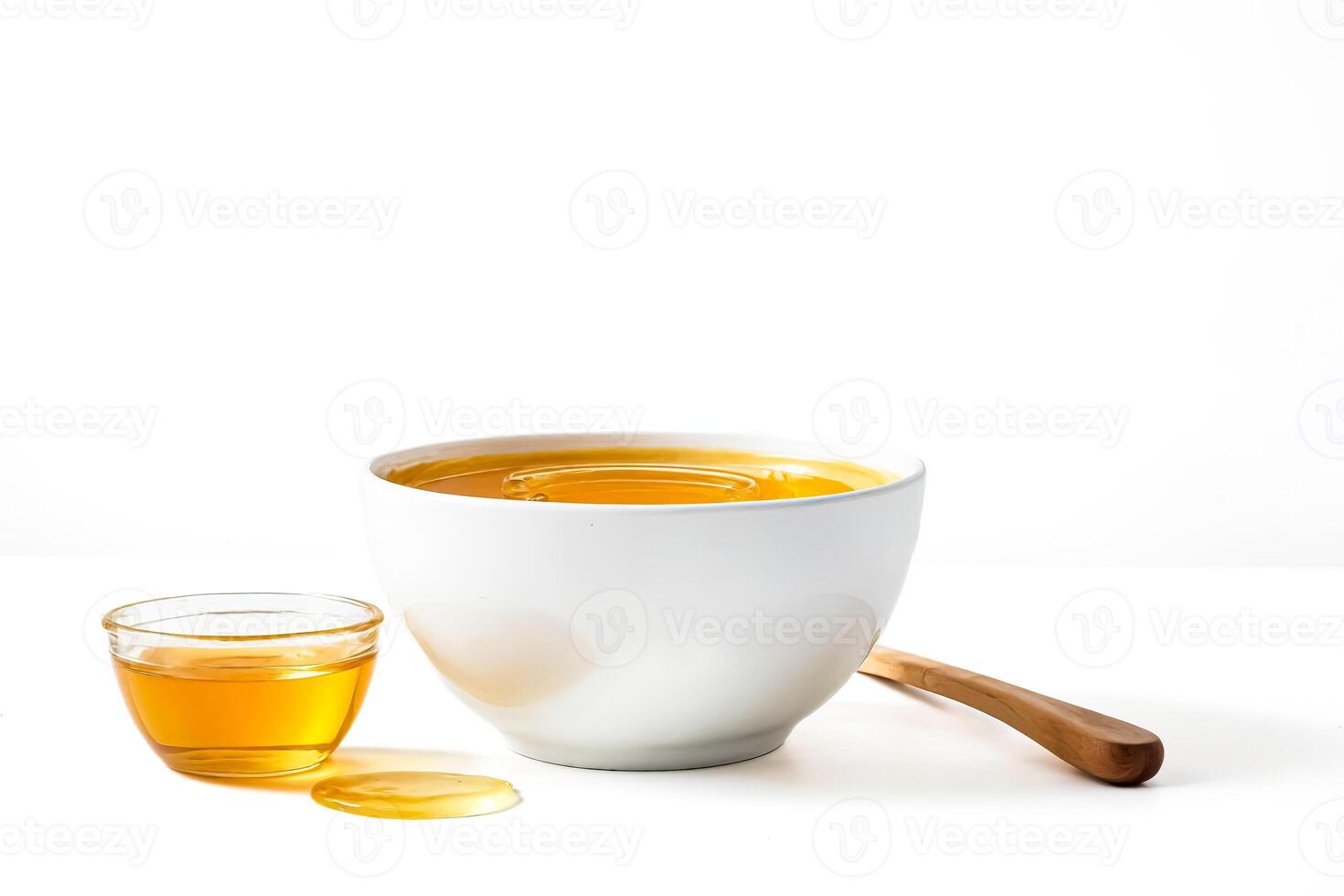 Honey in a White Bowl with Wooden Dipping Spoon photo