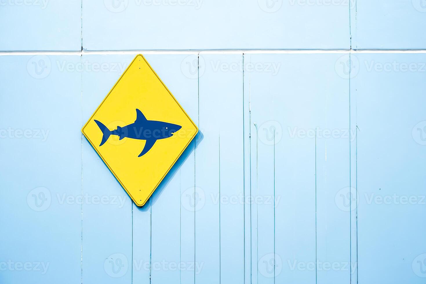 Shark Warning Sign on Blue Wall photo