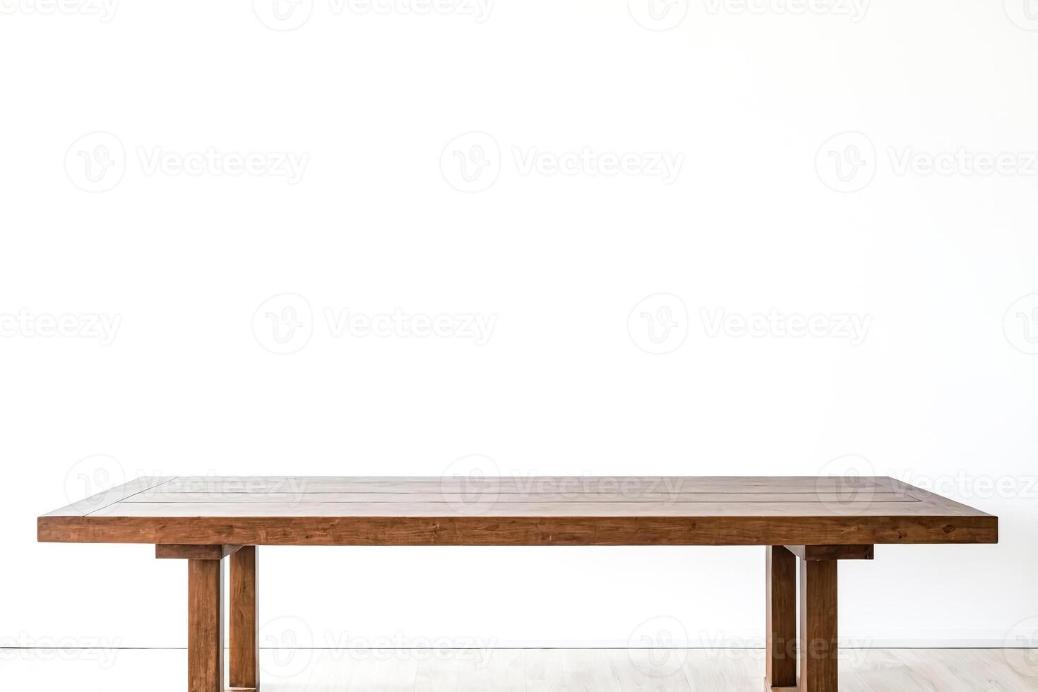Empty Wooden Table Against a White Wall photo