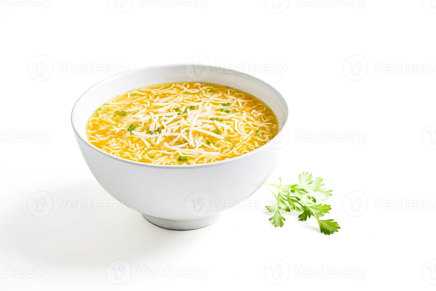 Chicken noodle soup in a white bowl with cilantro garnish photo