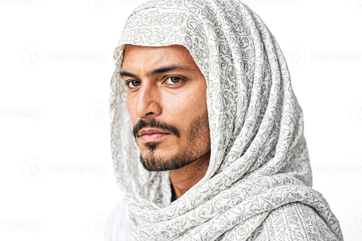 Portrait of a Young Man Wearing a White Headscarf photo
