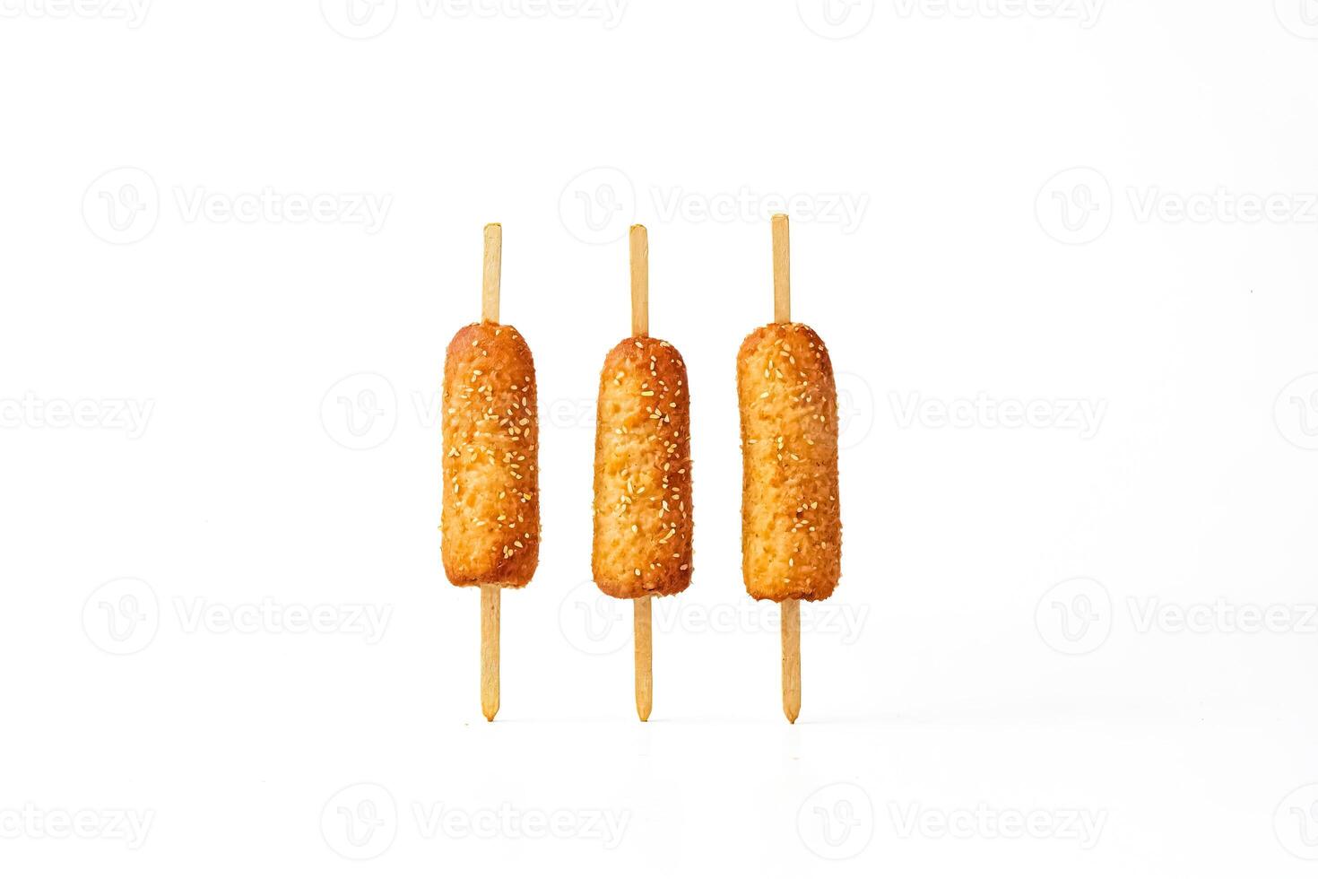 Three Korean Corn Dogs on Sticks photo
