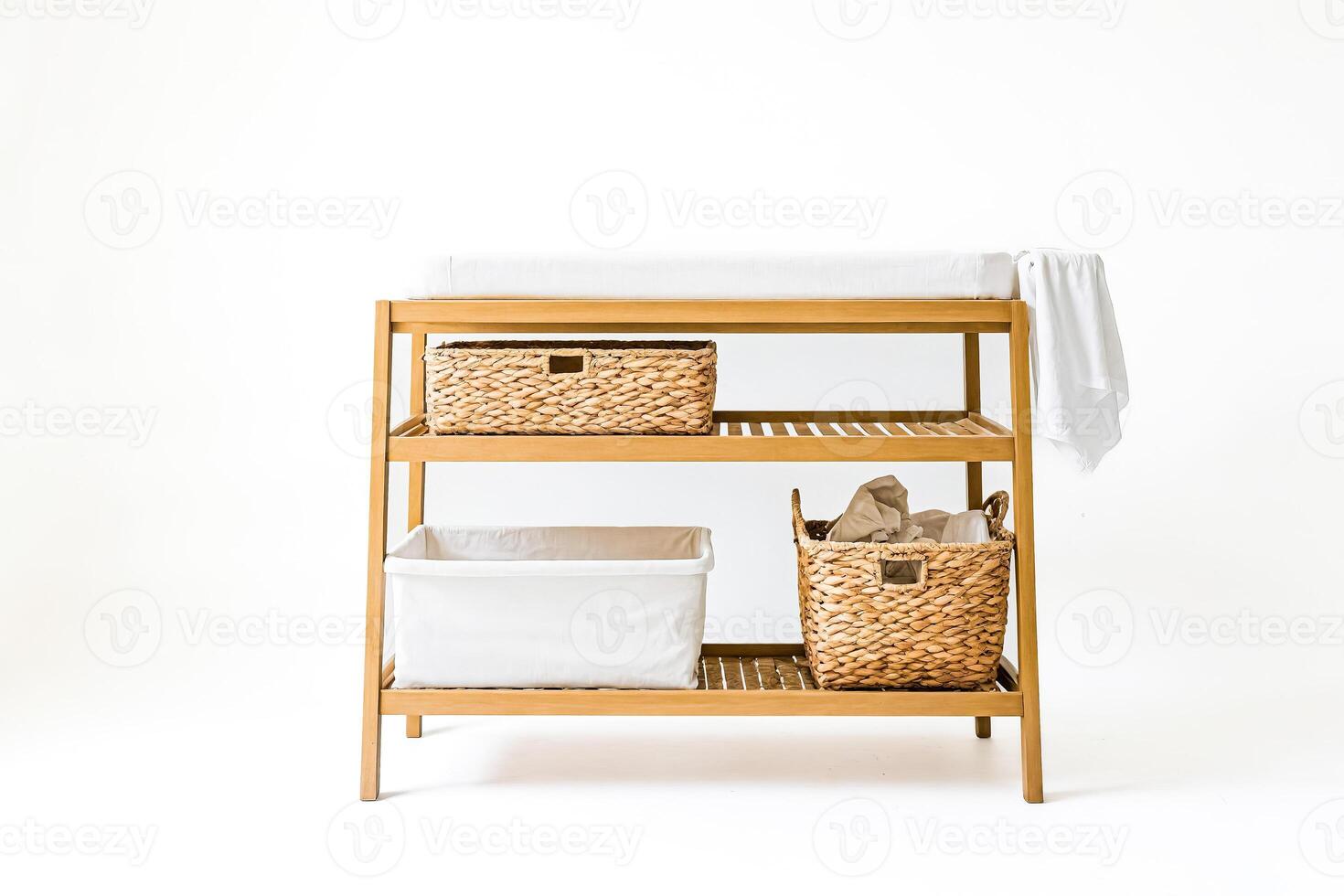 Wooden Changing Table with Wicker Baskets and White Fabric photo