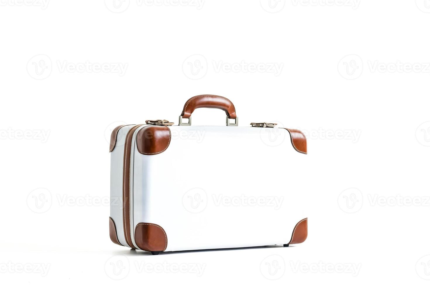 White suitcase with brown leather accents photo