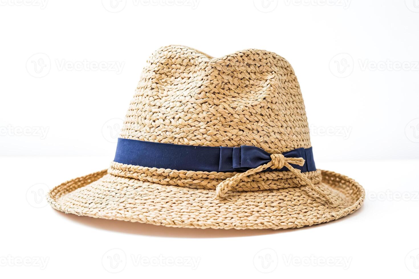 Straw hat with blue ribbon photo