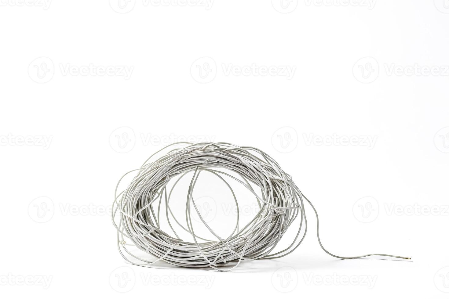 White Electrical Cable Coil On White Background photo