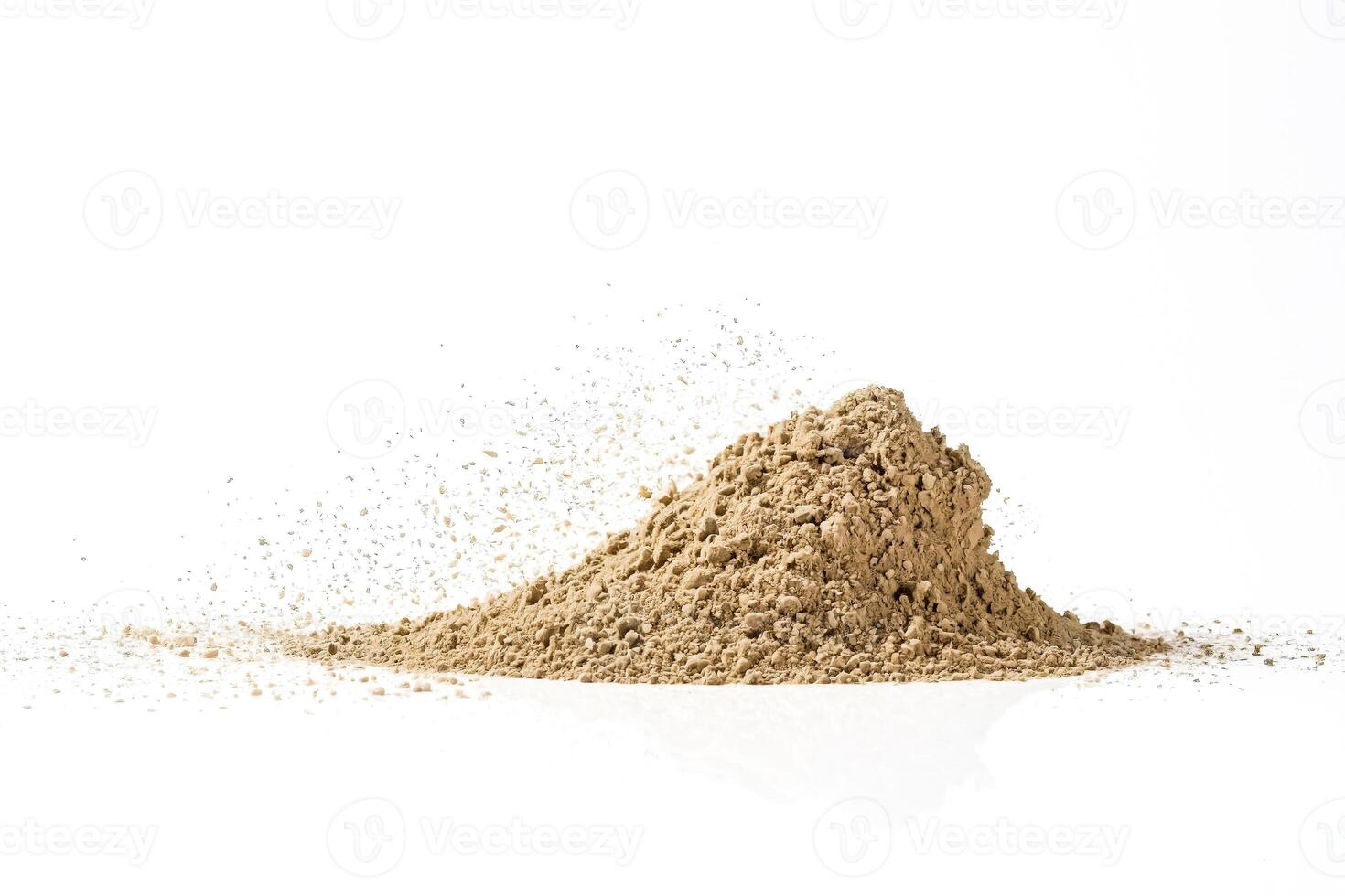 Brown powder pile isolated on white background photo
