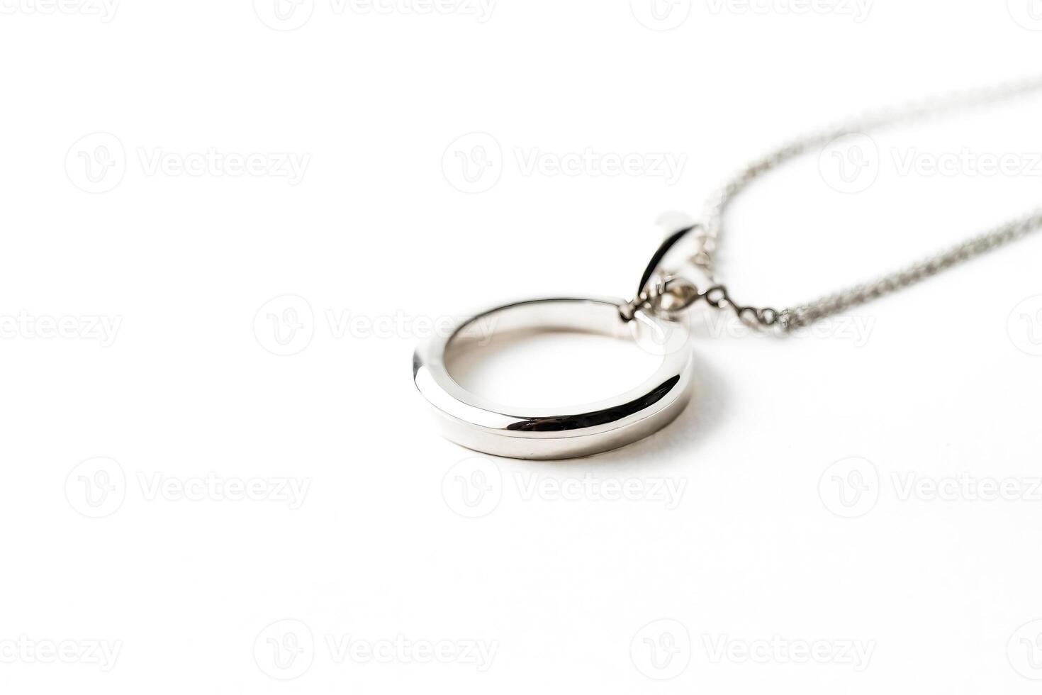 Silver circle pendant necklace on a white background photo