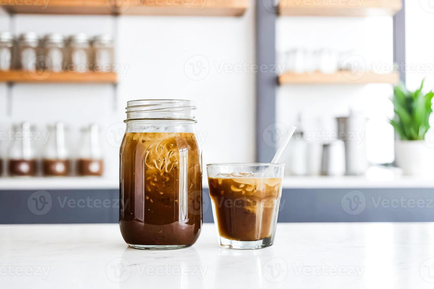 Iced Coffee in a Mason Jar on a White Table photo