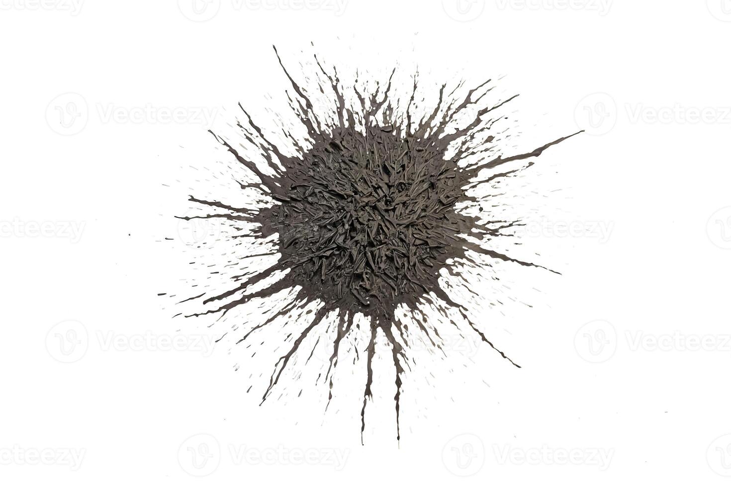 Abstract black paint splattered on white background photo