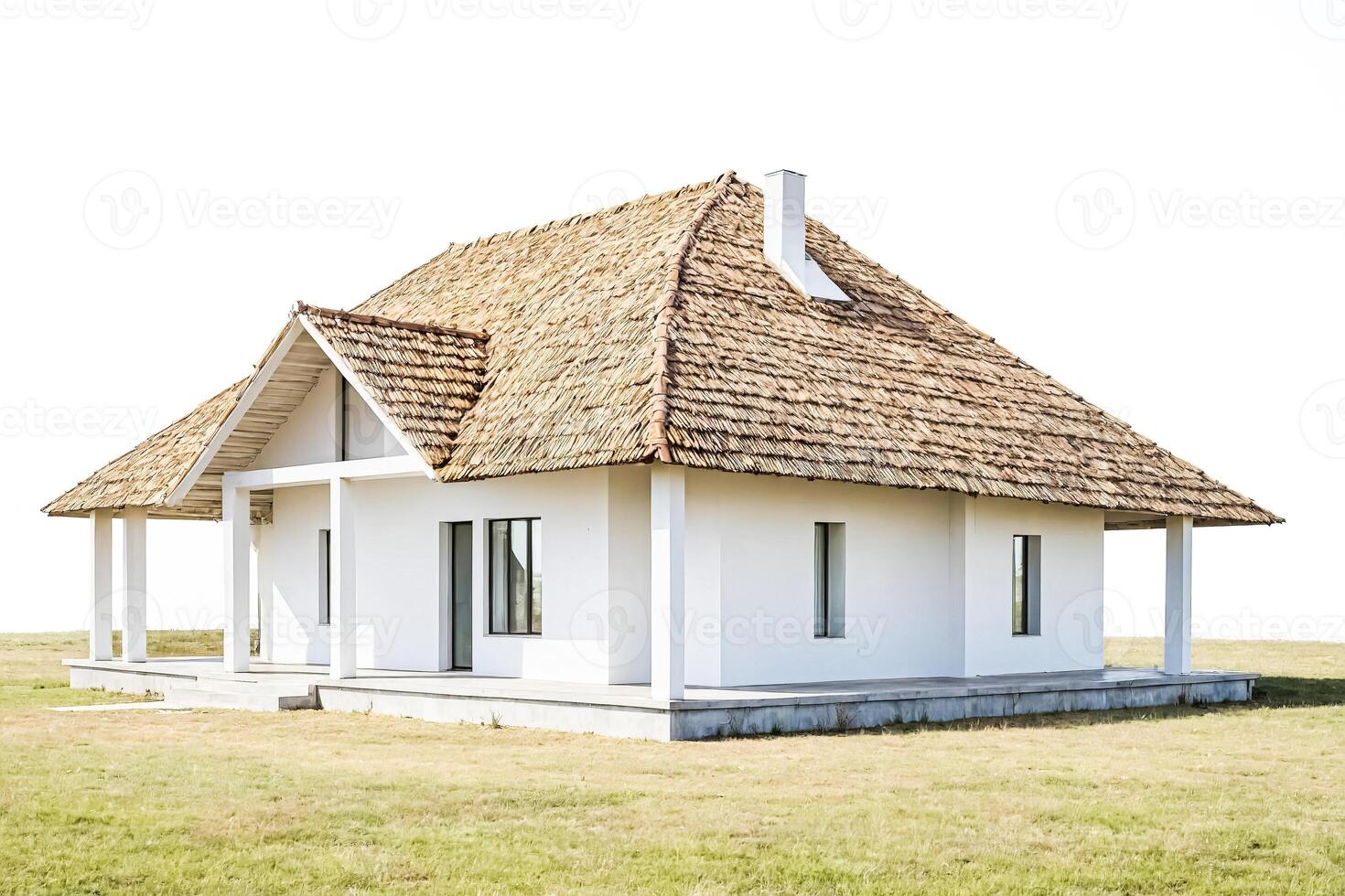 White house with thatched roof photo