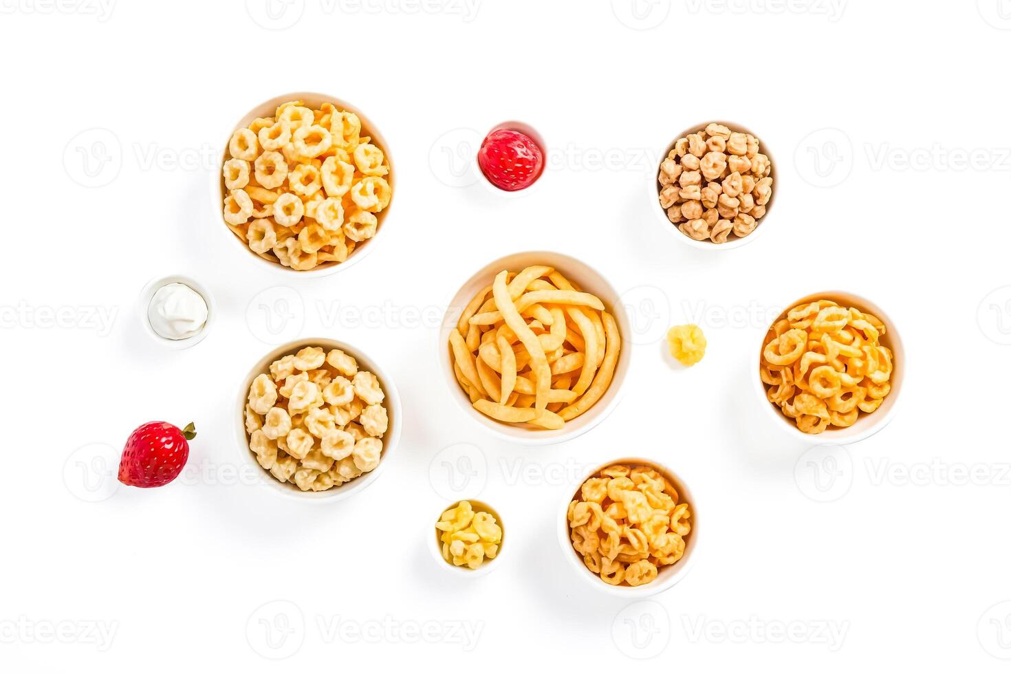 Various Snacks in Bowls on White Background photo