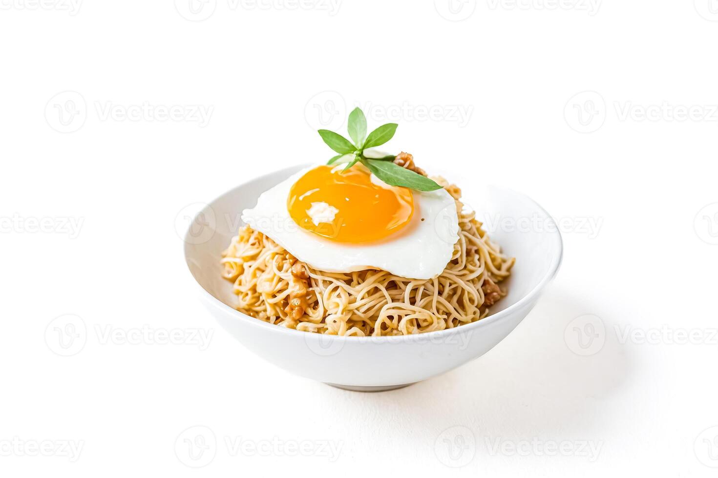 Bowl of Noodles with Fried Egg and Basil Leaf photo