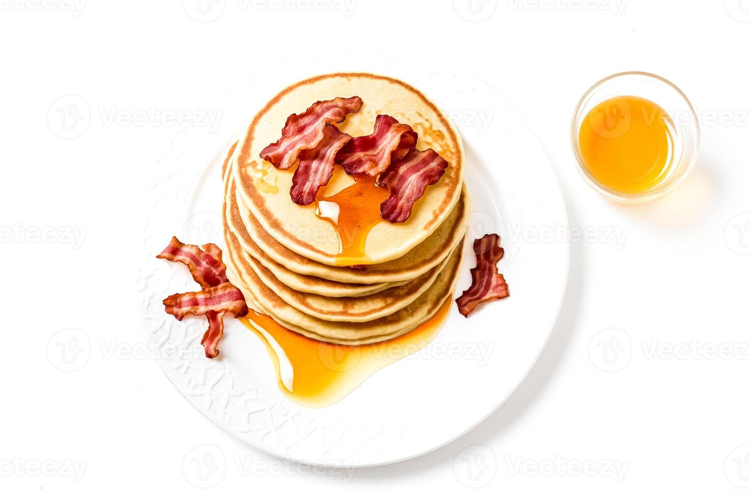 Delicious Stack of Pancakes with Bacon and Syrup on a White Plate photo