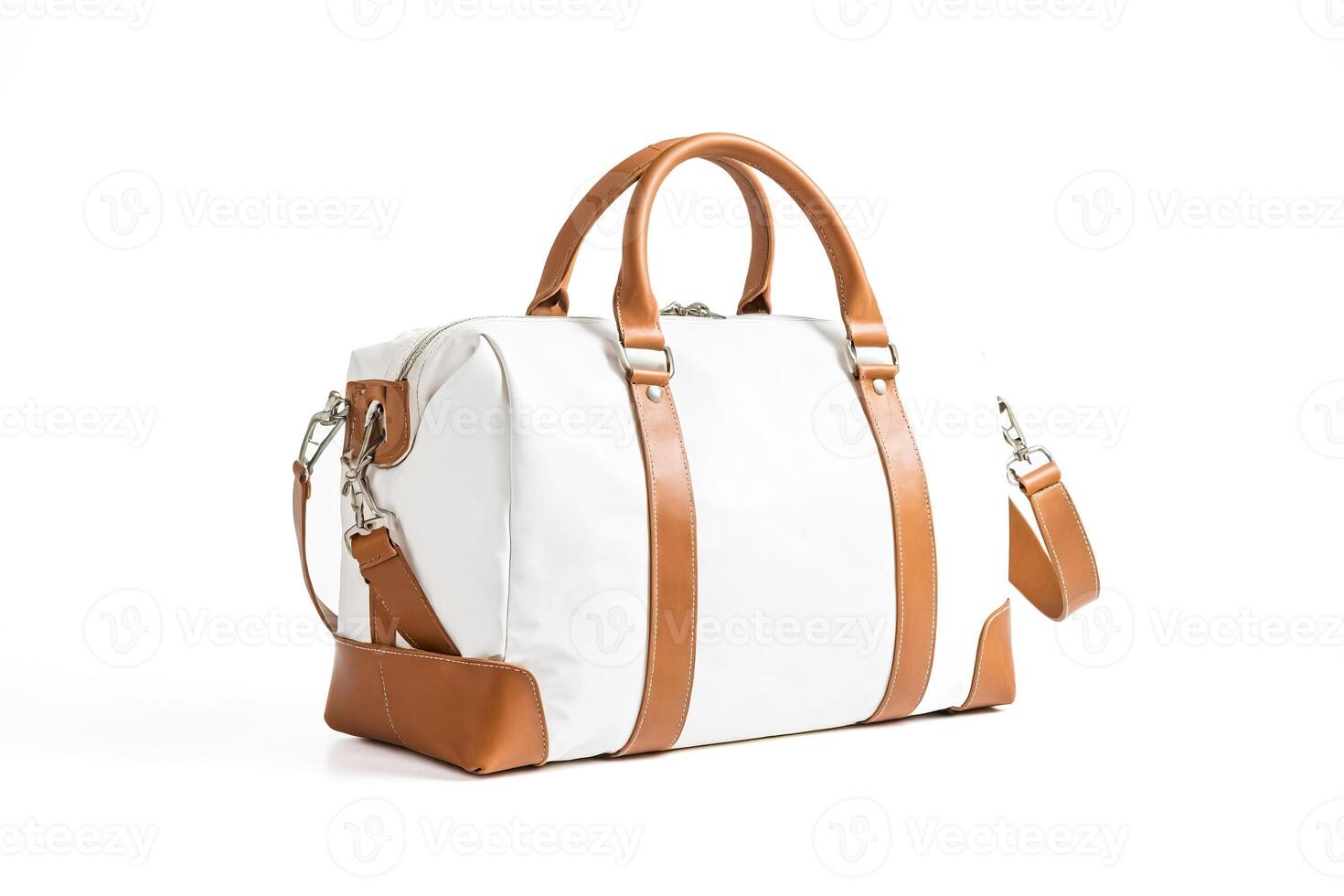 White leather duffel bag with brown leather accents photo