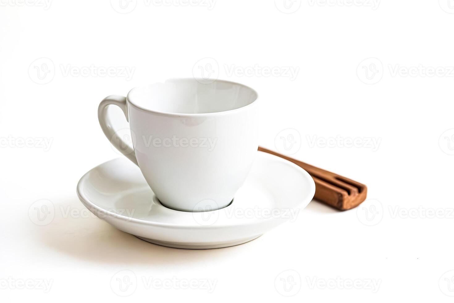 White Ceramic Coffee Cup and Saucer with Wooden Stirring Stick photo