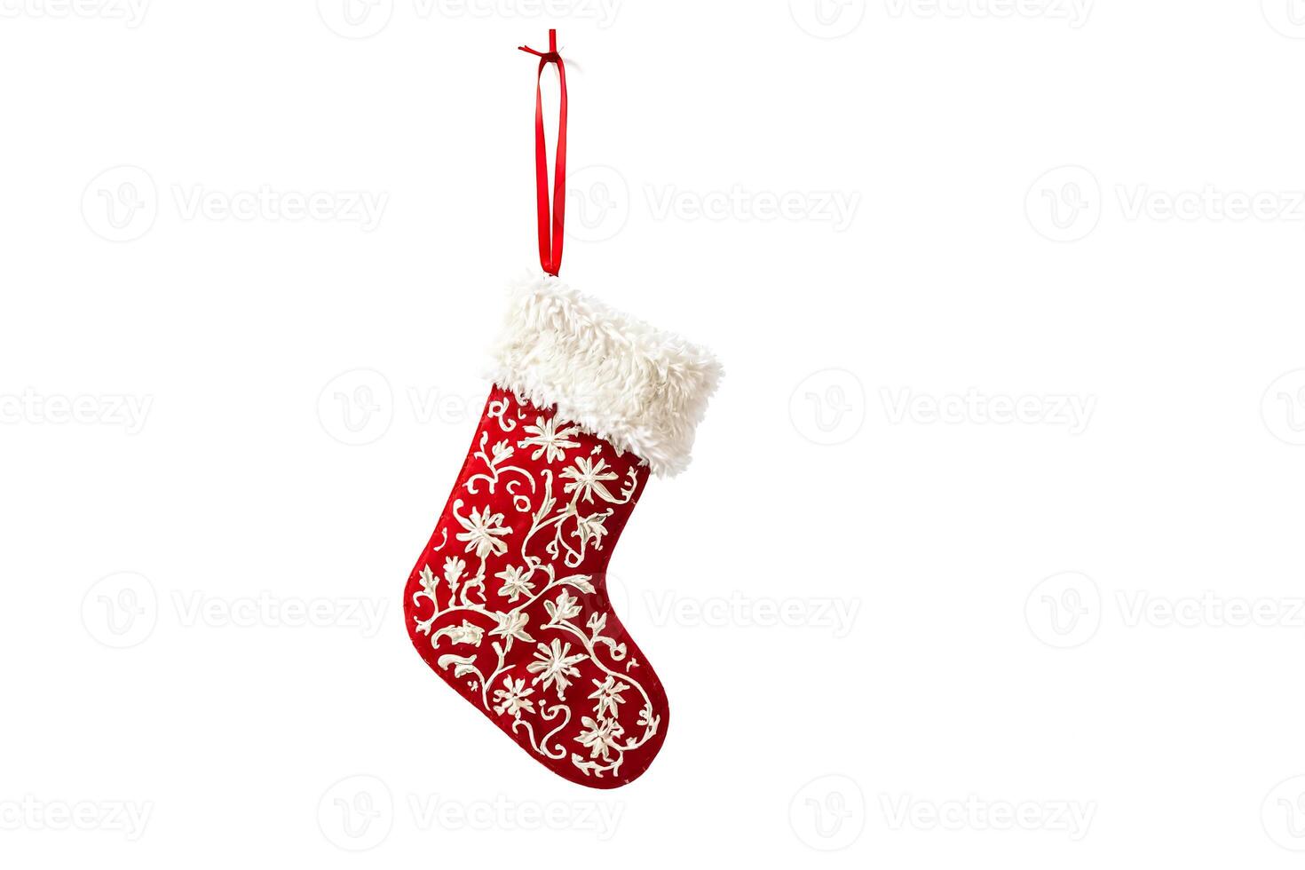 Red Christmas Stocking with White Fur and Floral Embroidery Hanging on White Background photo