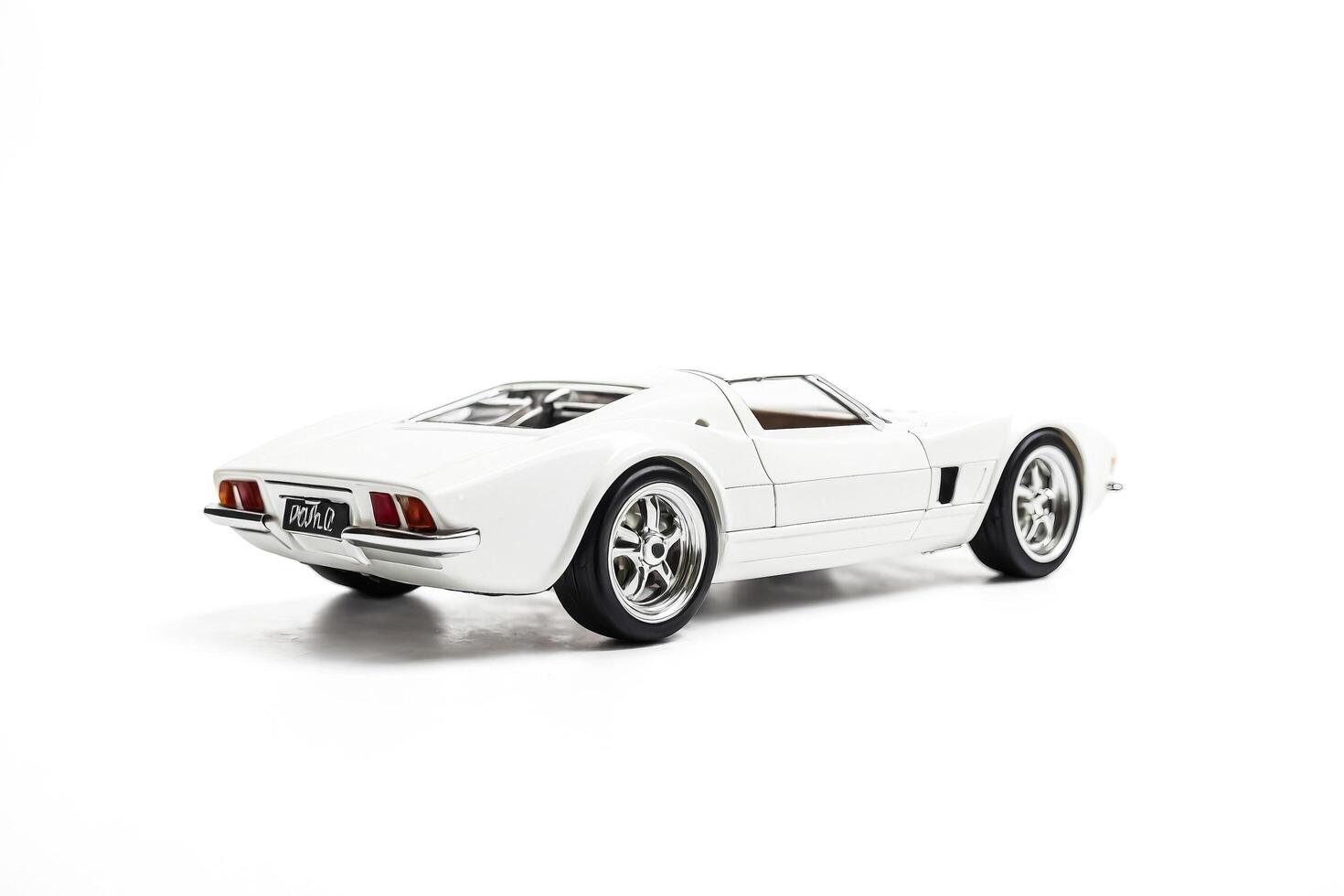 White Classic Sports Car Model Isolated on White Background photo