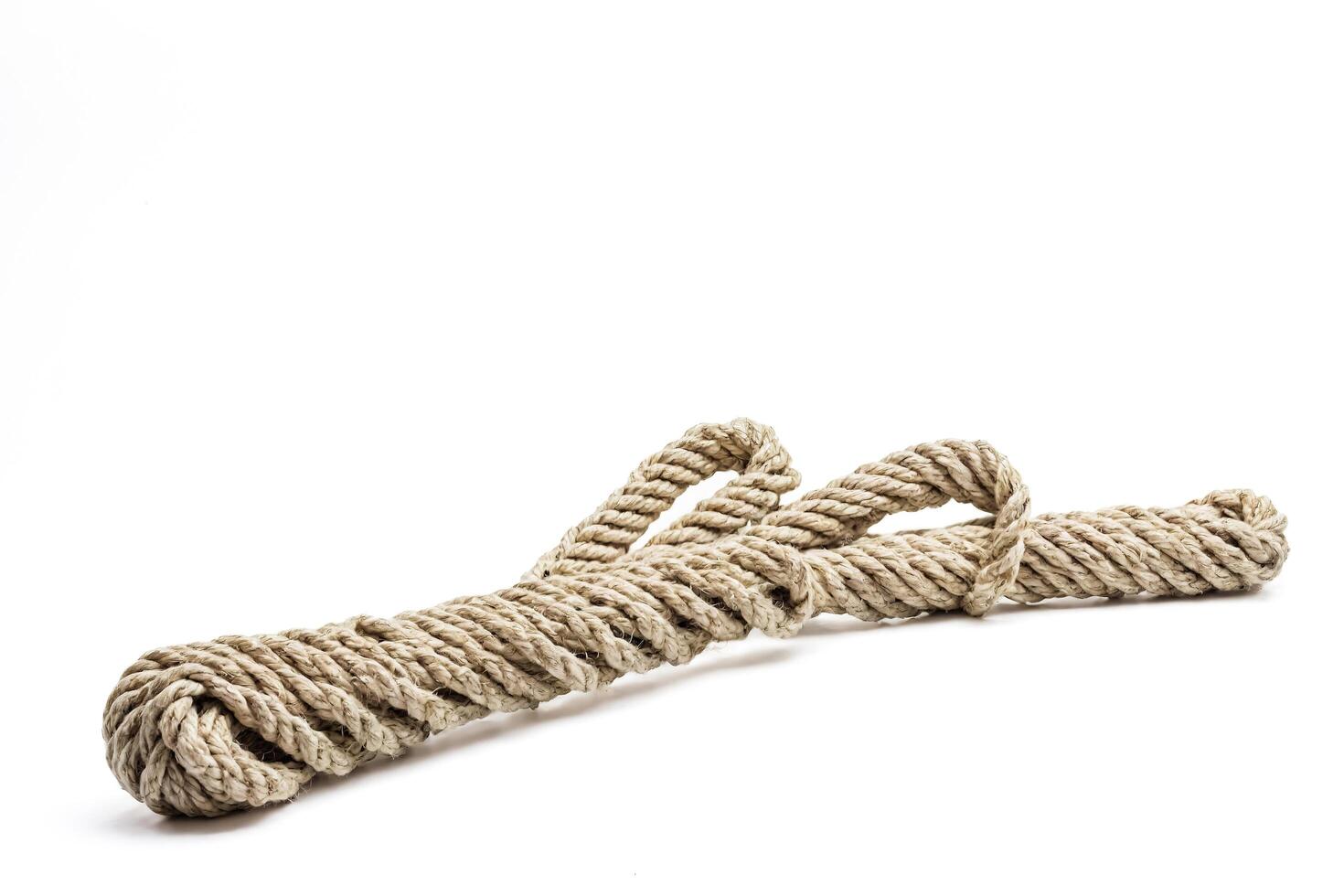 Close-up of a Twisted Rope Isolated on White Background photo