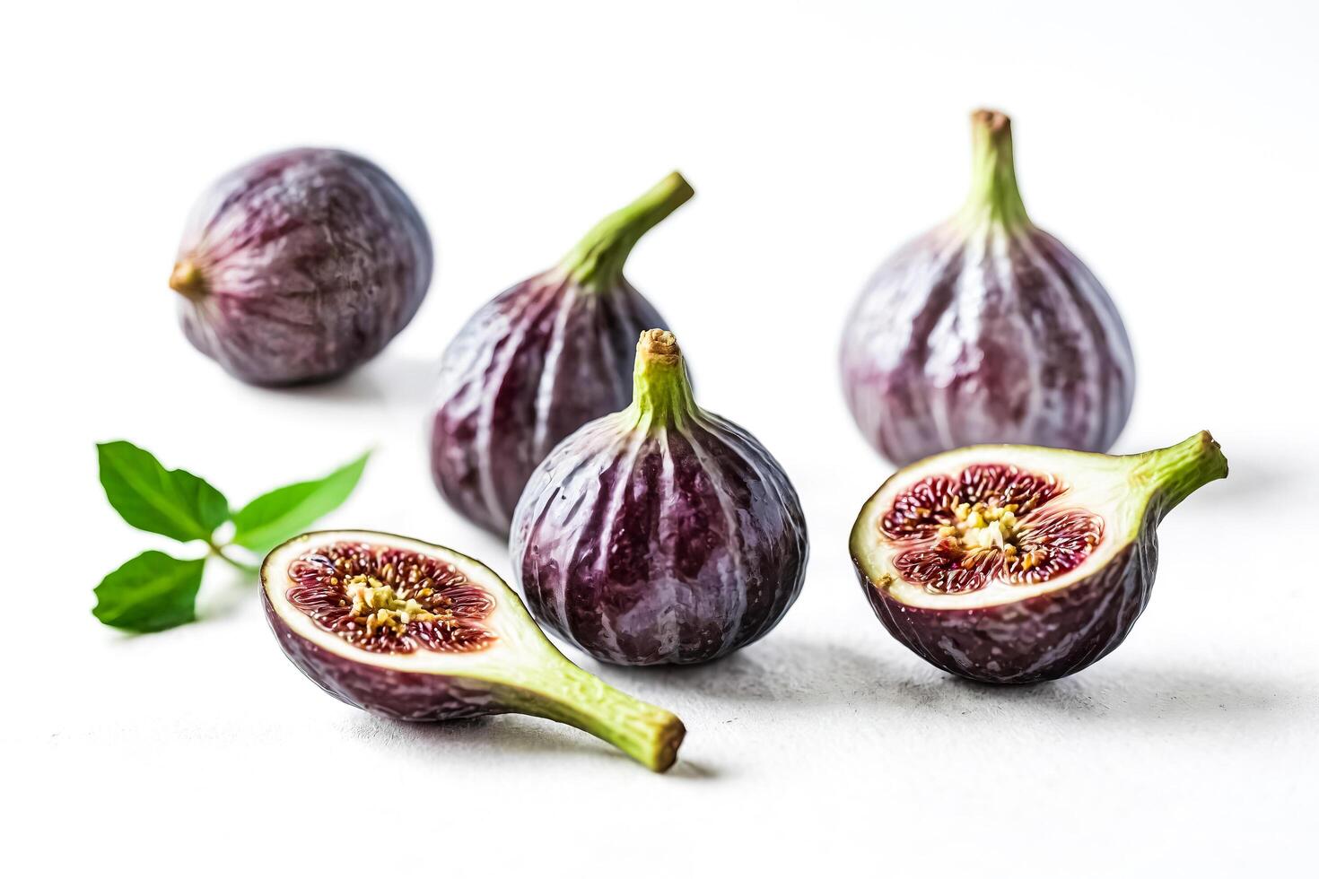 Closeup of Fresh Figs on White Background photo
