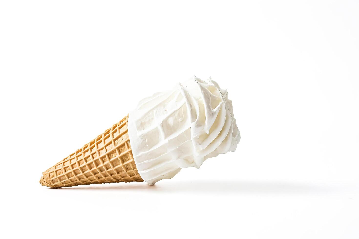 Soft Serve Ice Cream Cone Isolated on White photo