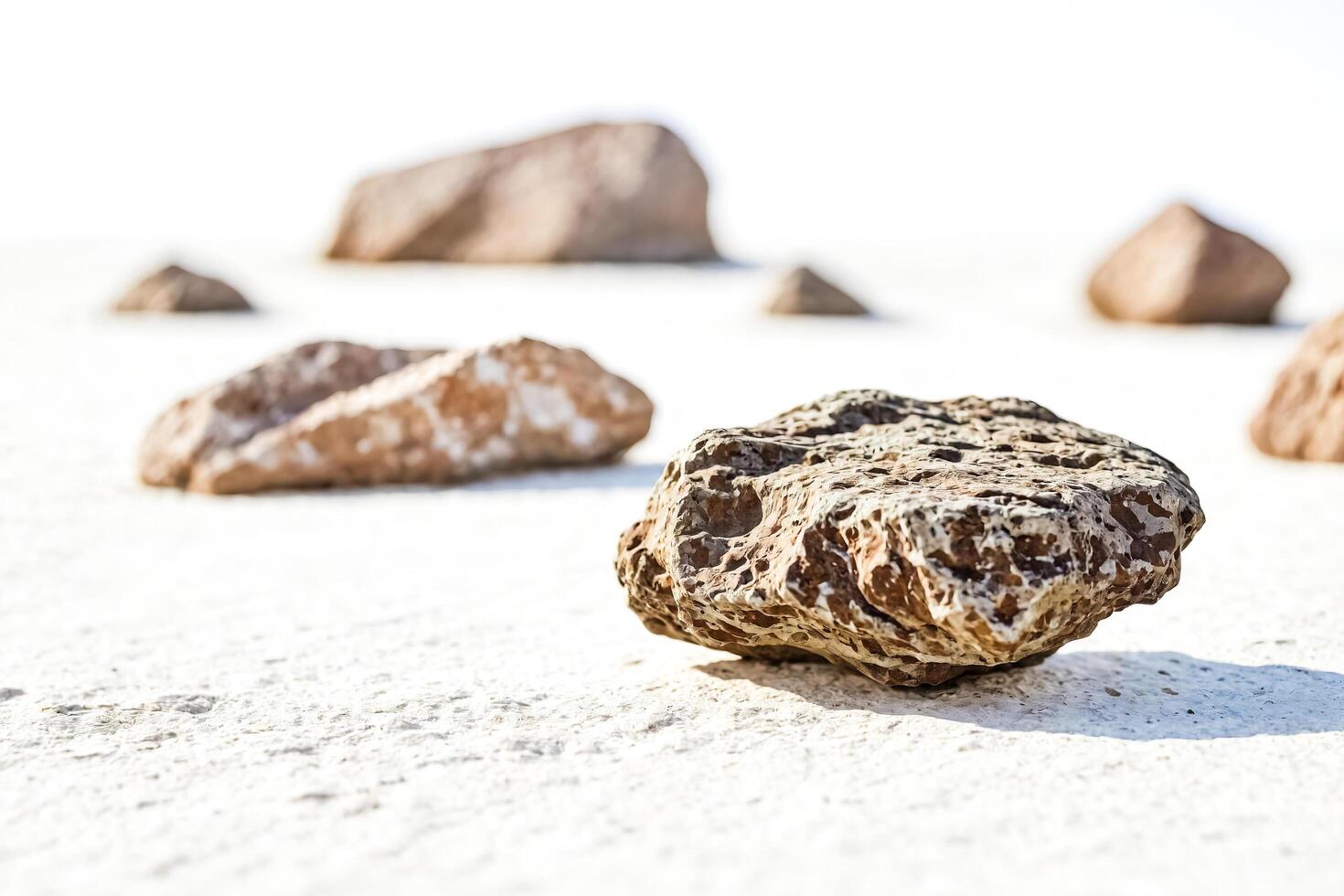 Stone on White Sand photo