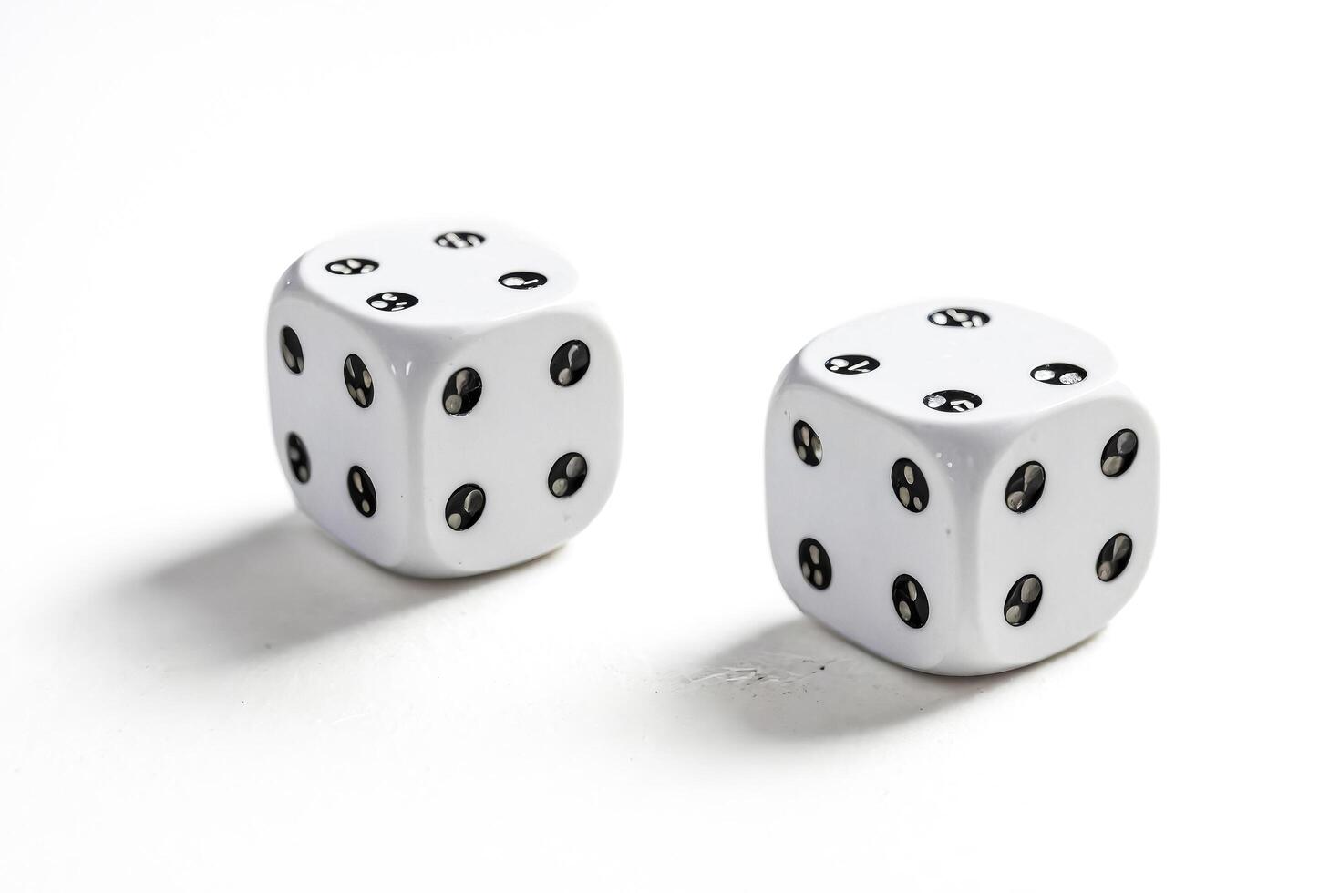 Close Up of Two White Dice on a White Background photo