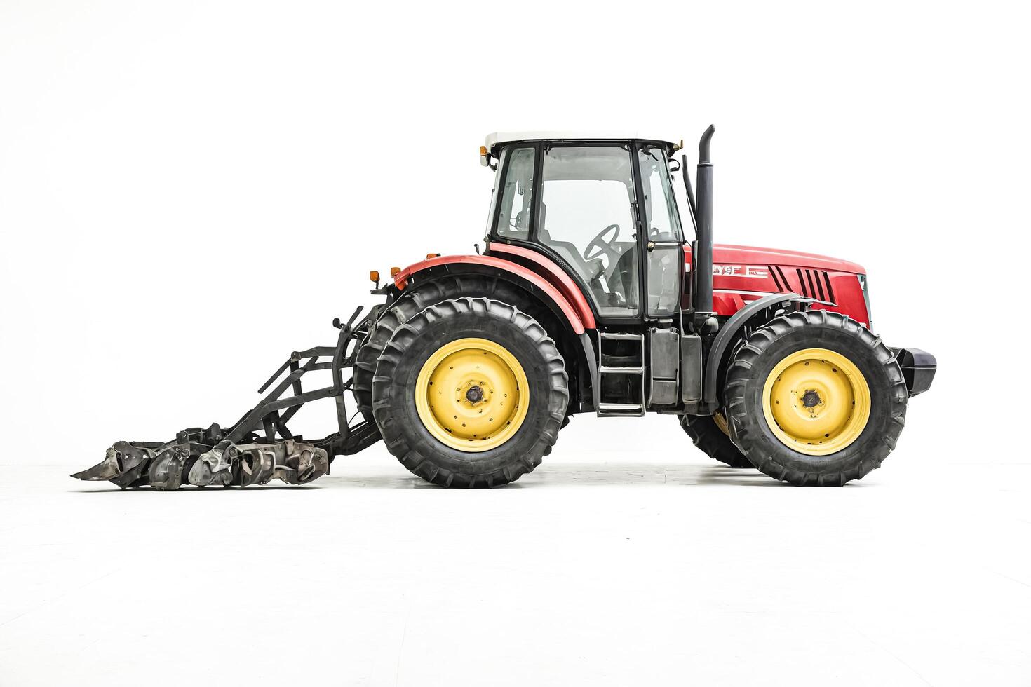 Red Tractor with Front Loader Isolated on White Background photo