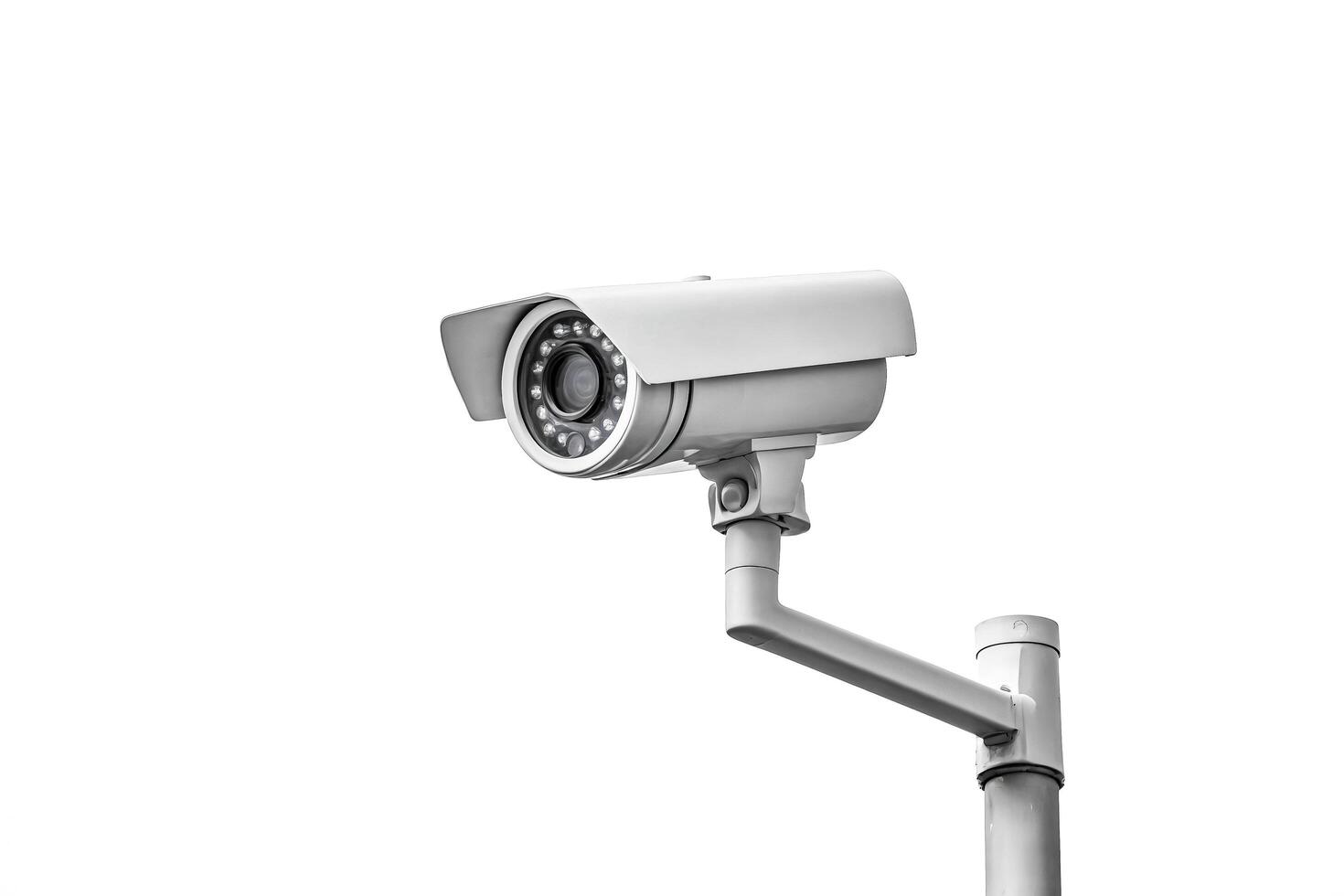CCTV camera on a pole against a white background photo