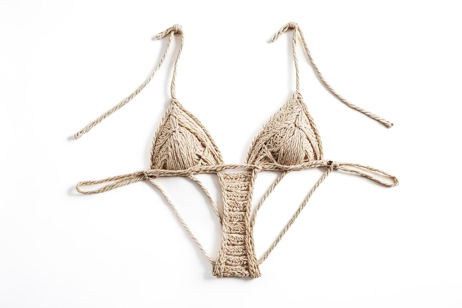Beige crochet bikini top isolated on white background photo