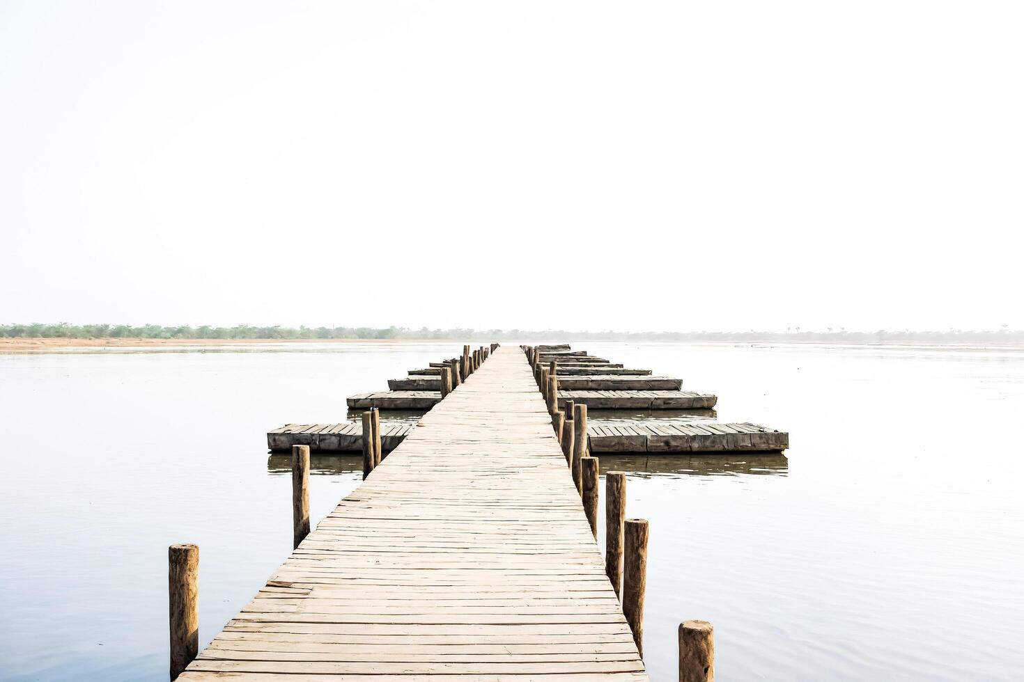Wooden path leading to the horizon photo