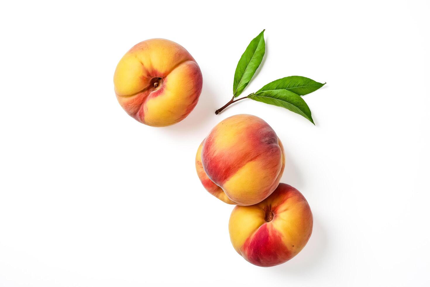 Three Ripe Peaches with Green Leaves Isolated on White Background photo