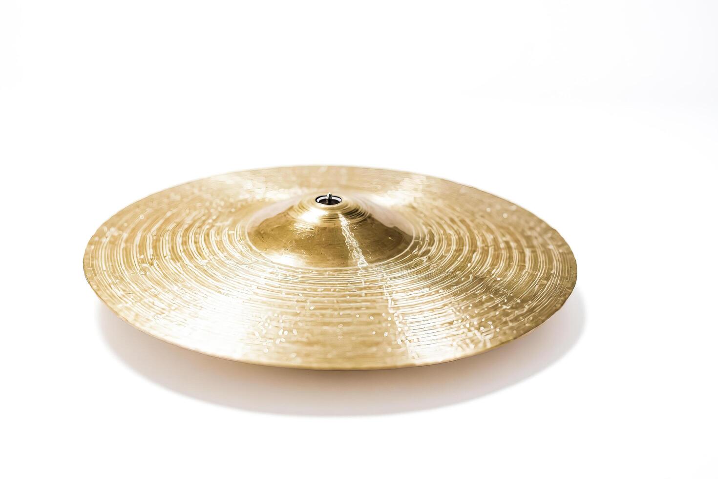 Gold Cymbal on White Background photo