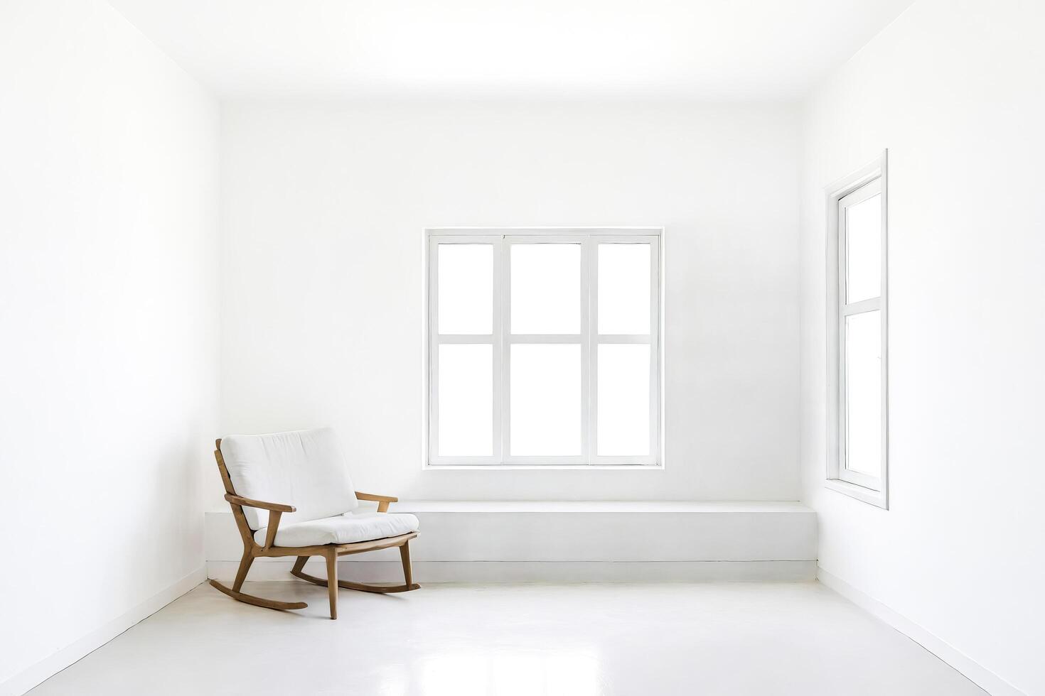 Minimalist white room with rocking chair and window photo