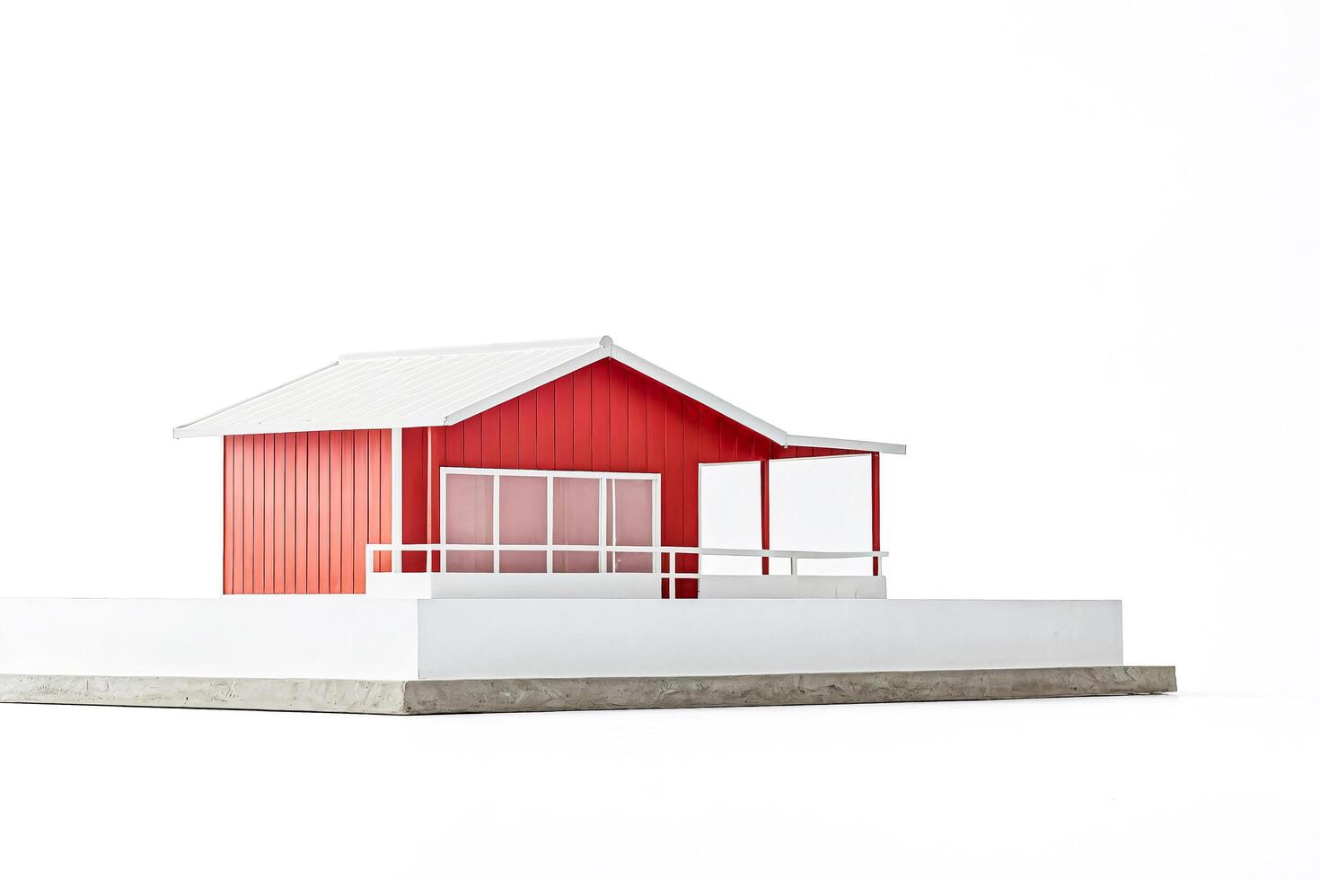 Red and White Model House on a White Background photo