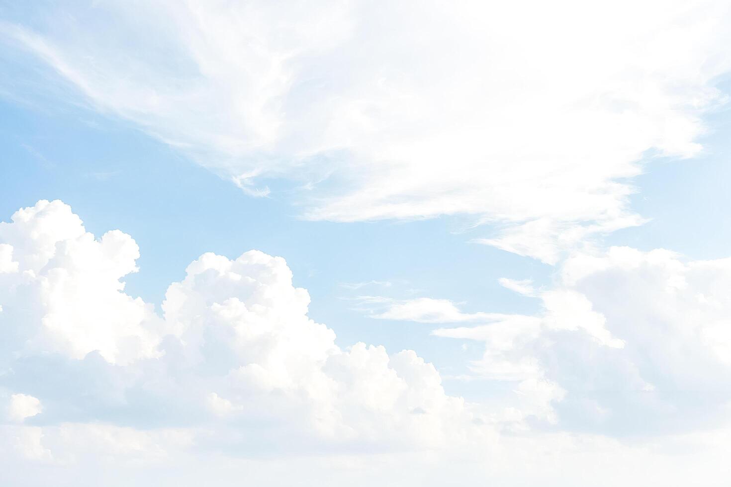 White fluffy clouds on a blue sky photo