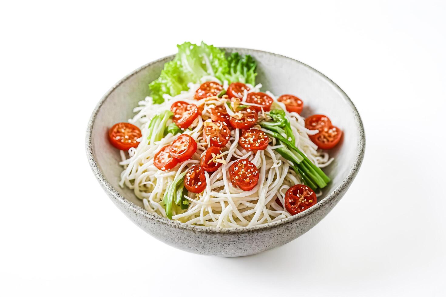 Bowl of rice noodles with cherry tomatoes and lettuce photo