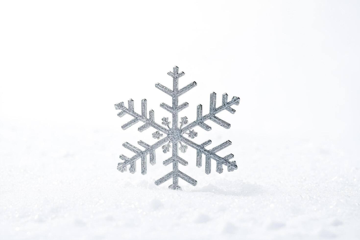 Silver Snowflake on White Snow photo