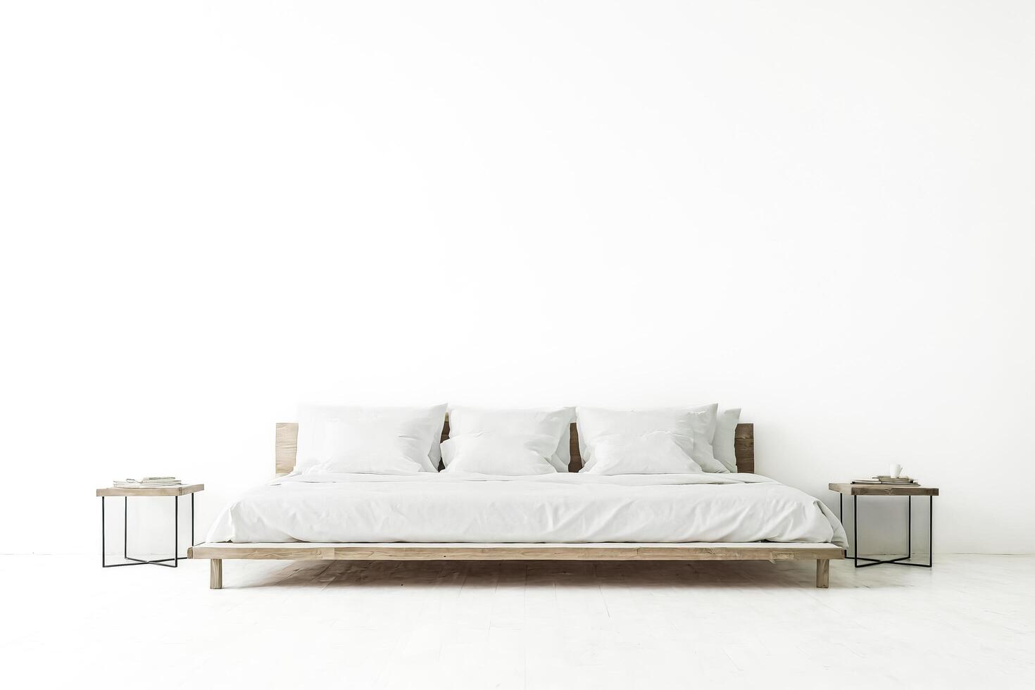 Minimalist Bedroom Interior with Wooden Bed Frame and White Bedding photo